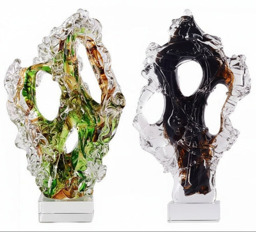 Abstract glass sculptures in green and black on crystal bases