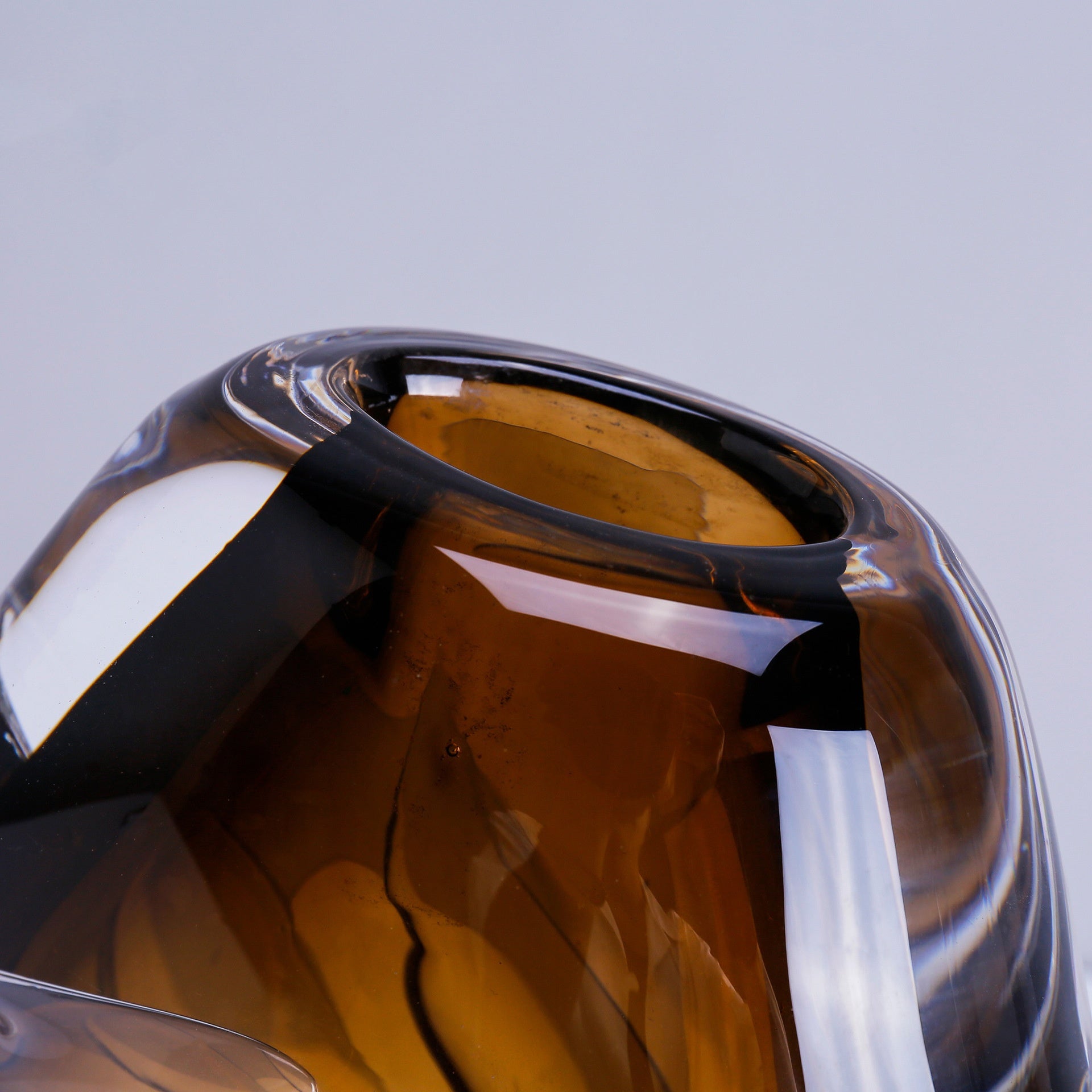 Close up of thick clear glass rim with amber core