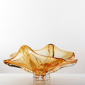 Front view of amber art glass ruffled centerpiece bowl