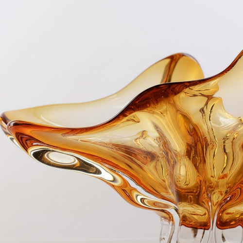 Detail shot of organic ruffled rim and amber glass texture
