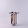 Tall art glass vase with wavy rim and brown swirls