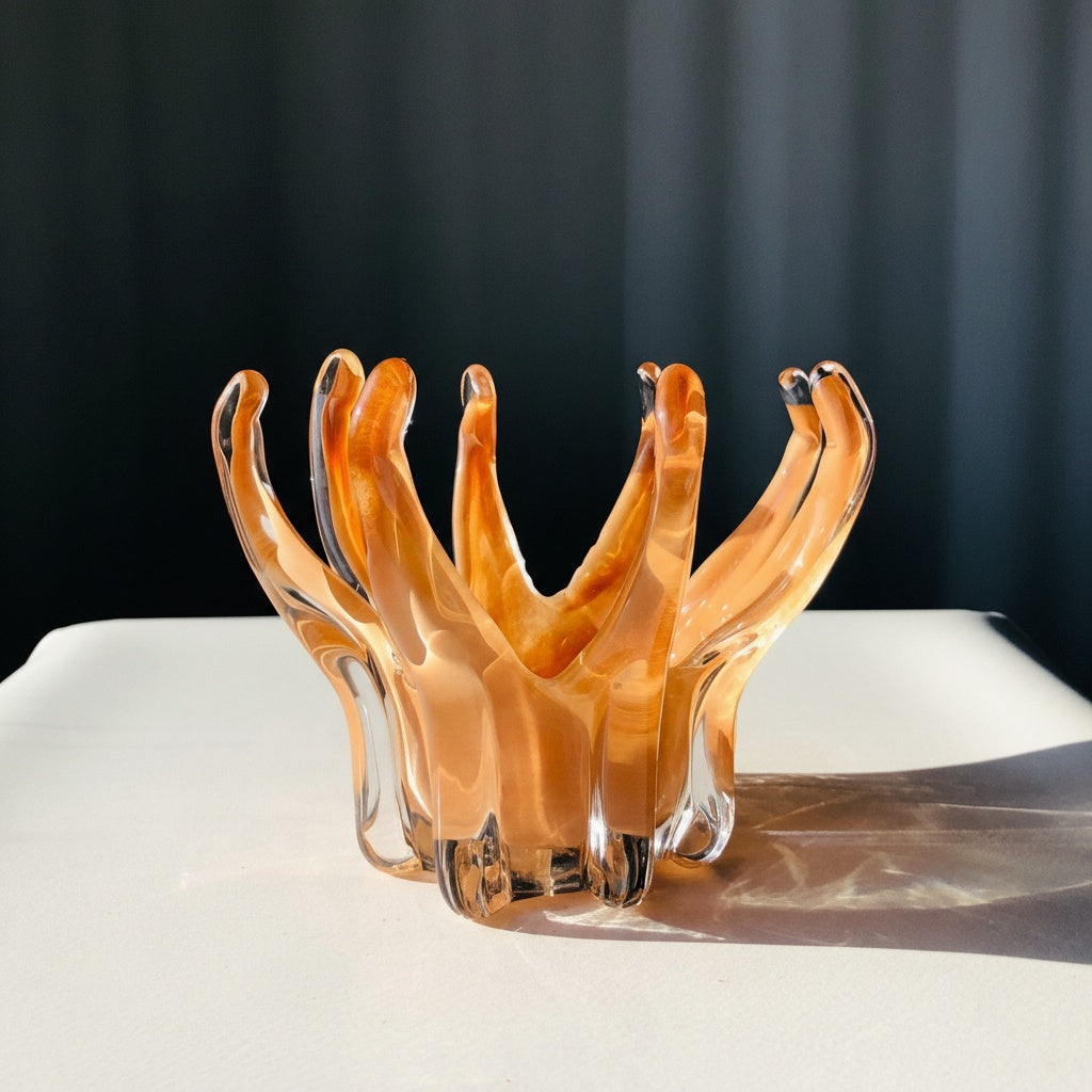 Side view of amber art glass organic splash bowl