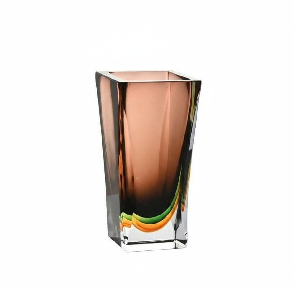 Detailed view of amber art glass vase with thick clear base