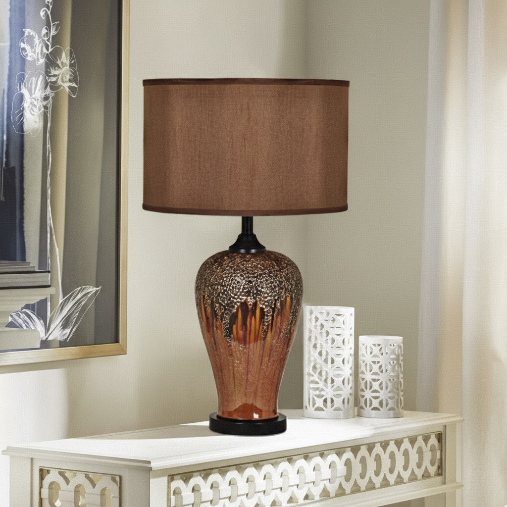 Contextual view of ceramic table lamp on console table with decor