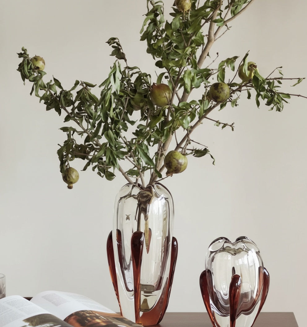 Styled amber glass vase with botanical arrangement