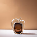 Large amber glass apple sculpture with clear casing