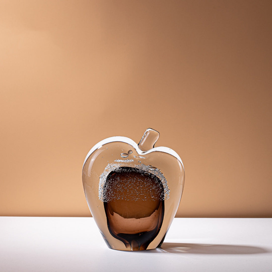 Large amber glass apple sculpture with clear casing