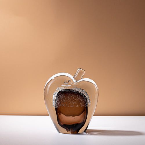 Large amber glass apple sculpture with clear casing