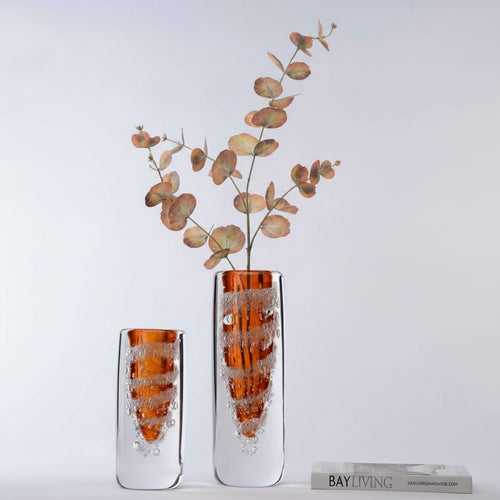 Amber and clear glass cylindrical vase with botanicals