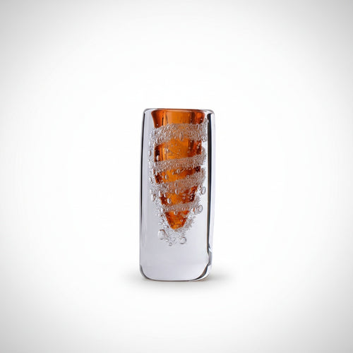 Close up of amber art glass vase with bubble texture