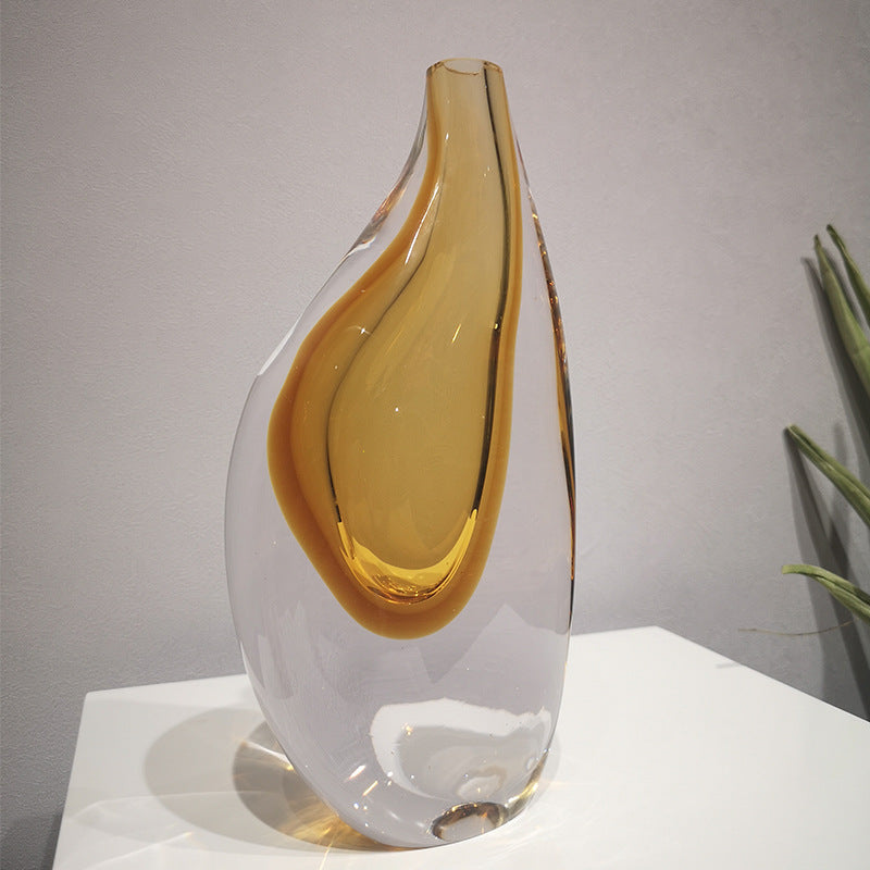 Close up of heavy glass vase with amber core