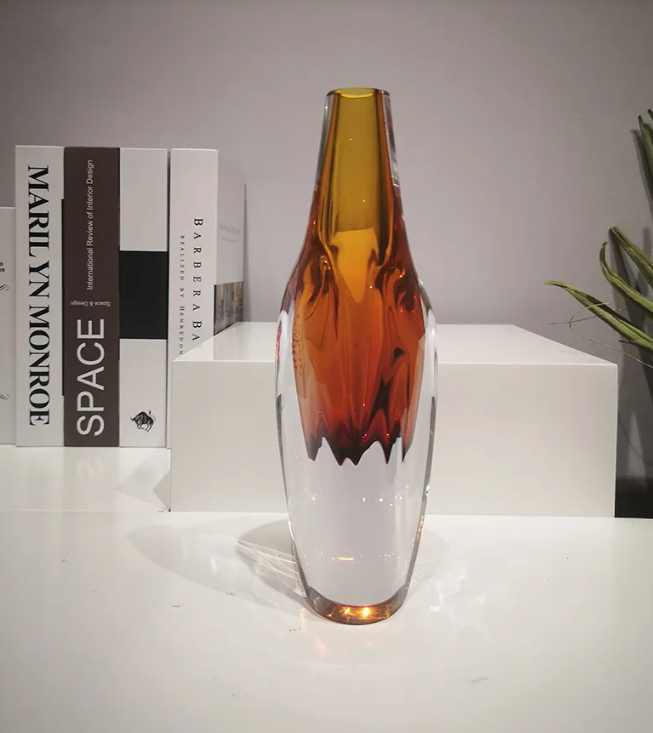Front view of the amber core vase on a table