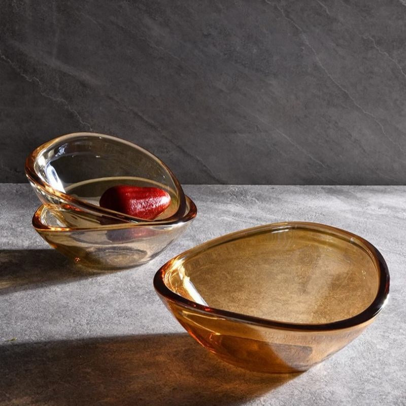 Amber crystal bowls in organic shapes nested together