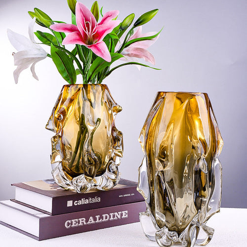 Large and medium amber crystal vases styled together