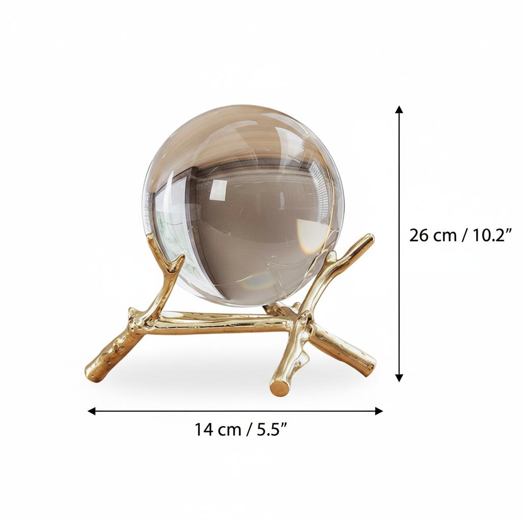 Side view of yellow crystal ball sculpture on marble table