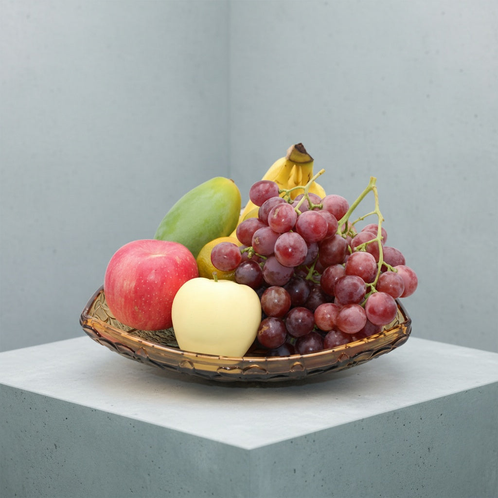 Amber crystal triangular fruit bowl filled with fresh fruit