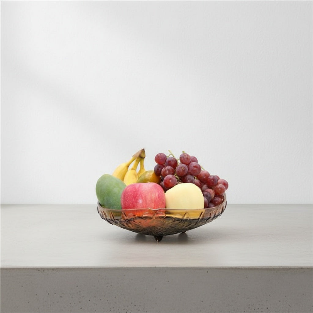 Angled view of triangular crystal bowl with fruit display