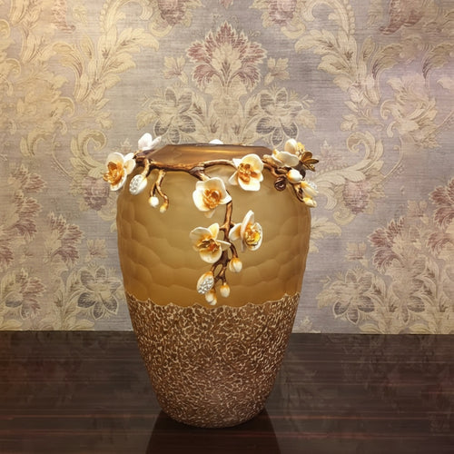 Front view of amber glass vase with enamel flowers