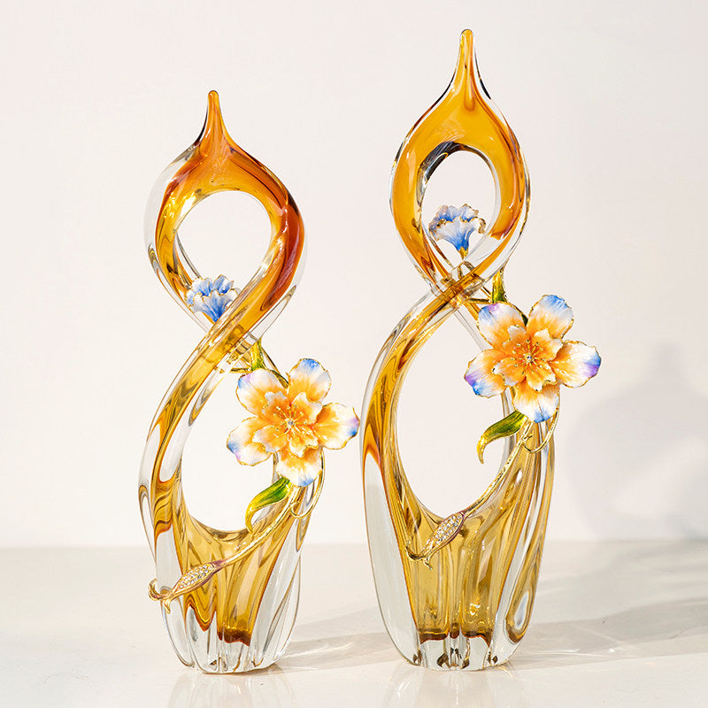 Full view of amber glass abstract sculpture with enamel flowers