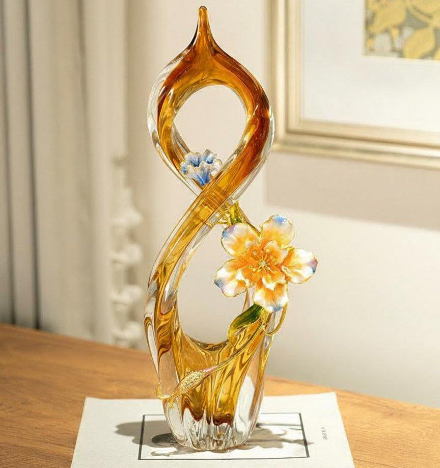 Amber art glass sculpture displayed on wooden table in luxury setting