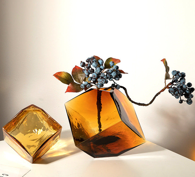 Amber glass faceted geometric vase with berries