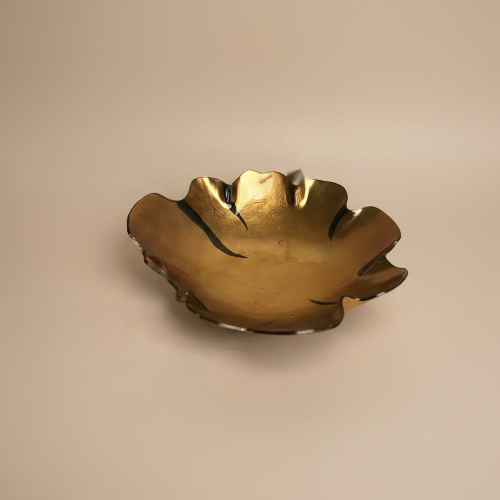 Close up of gold interior texture on amber glass bowl