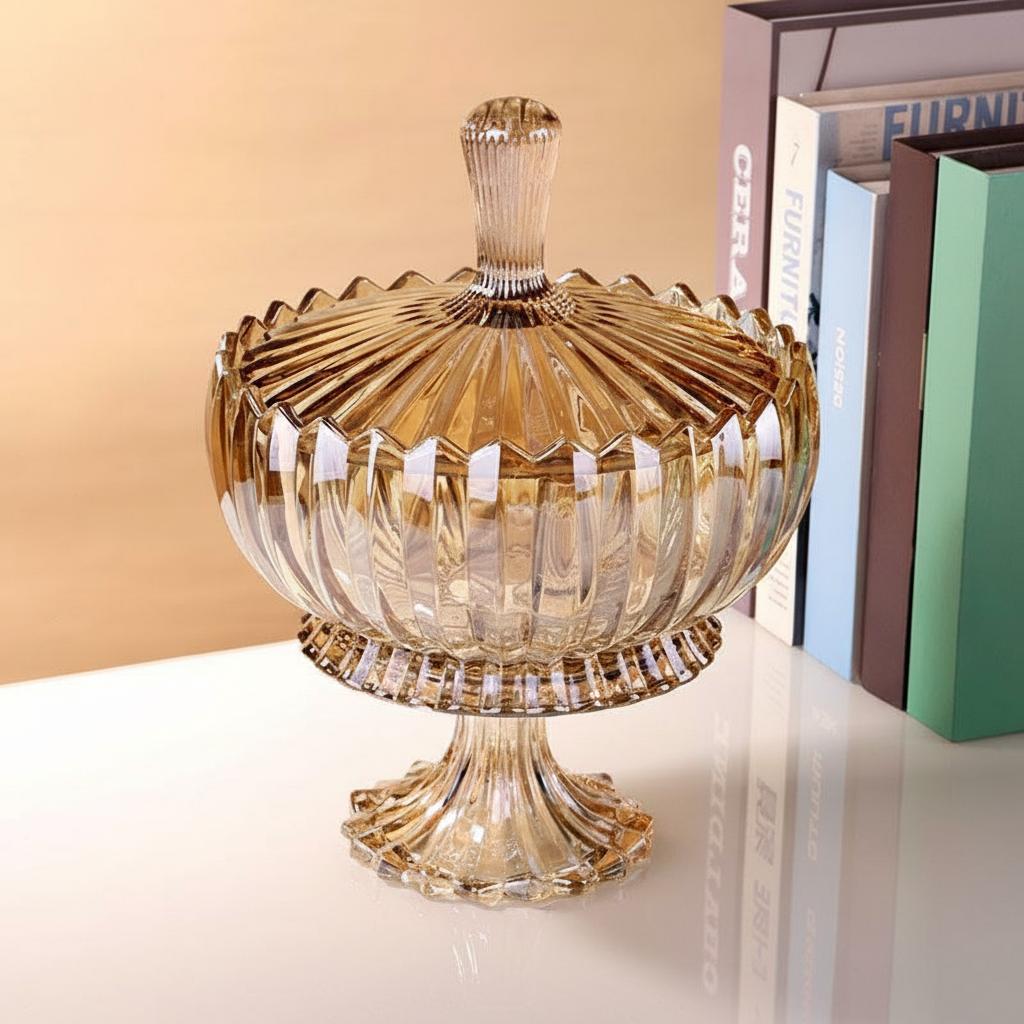Side view of fluted amber glass jar on books
