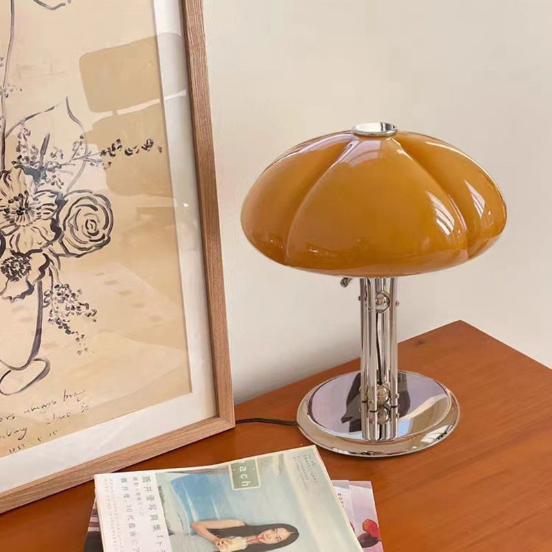 Lit amber glass table lamp displaying warm ambient glow