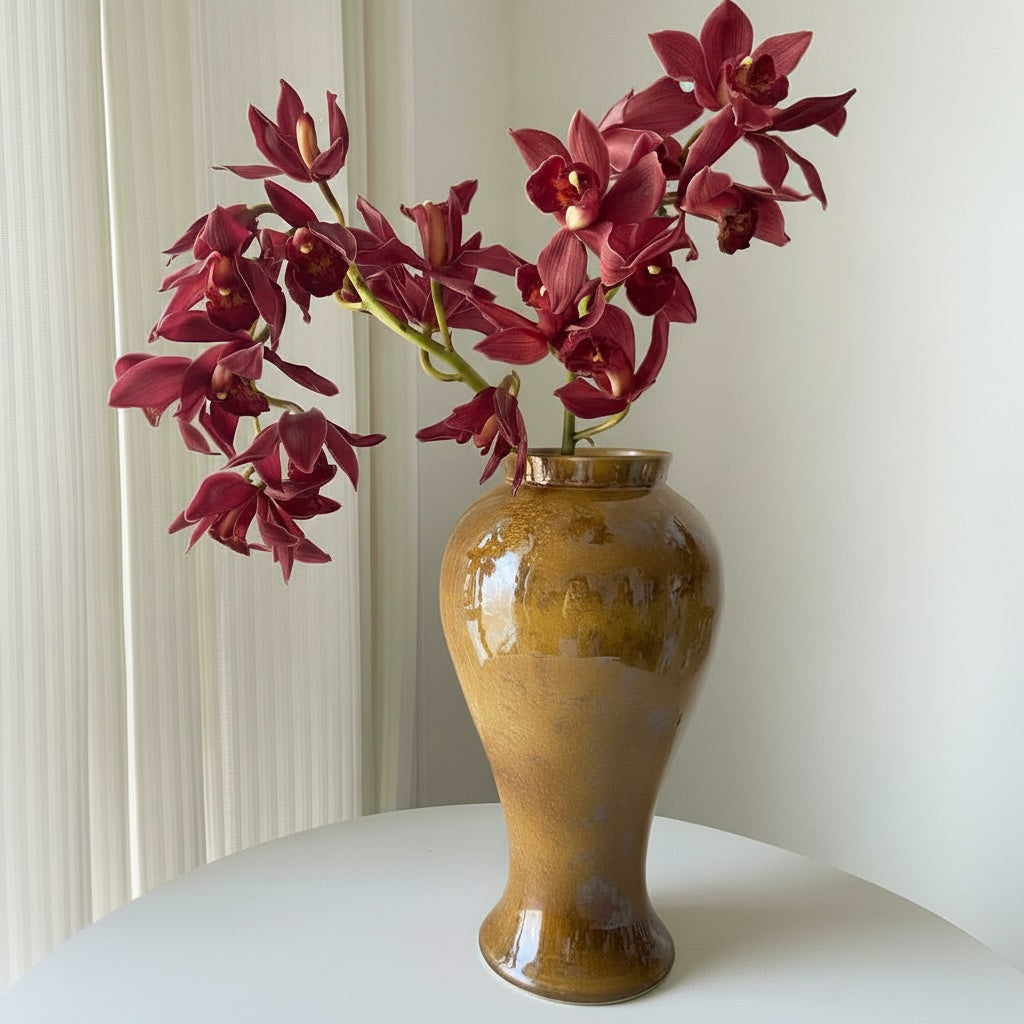 Amber Glazed Ceramic Baluster Vase With Floral Arrangement