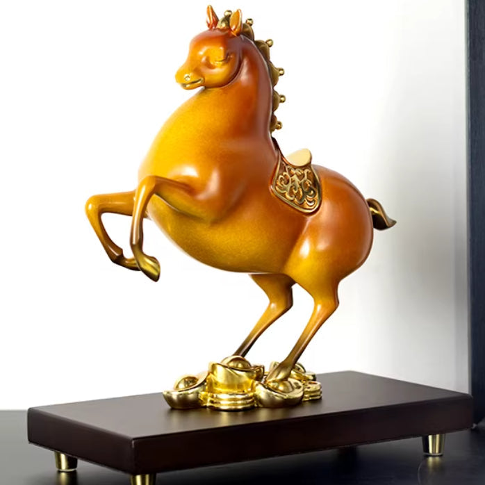 Angled view of rearing horse sculpture on wooden base