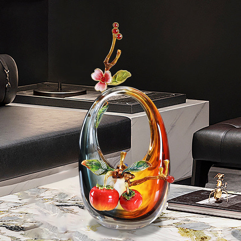 Front view of amber glass sculpture with enamel persimmon detail