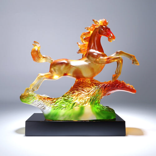Side profile of amber and green crystal galloping horse sculpture