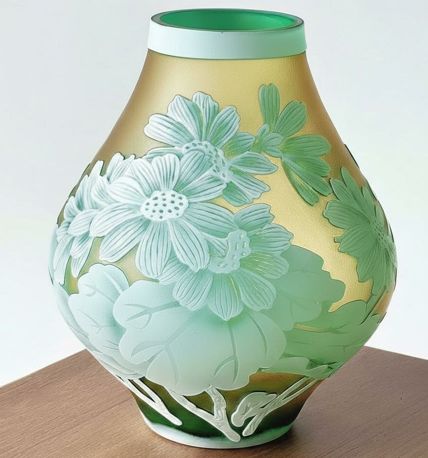 Full view of amber and green floral glass vase on wooden stand