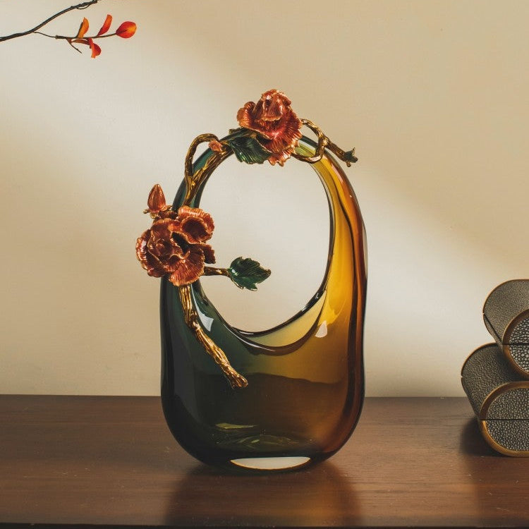 Close up of antique style metal rose sculpture on glass vase