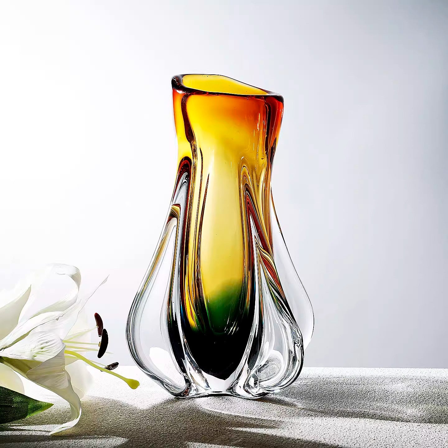 Angled view showing organic curves of the glass vase