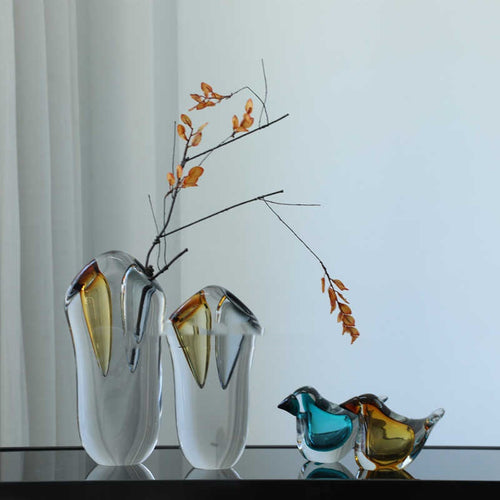 Styled art glass vases with branches and decorative birds
