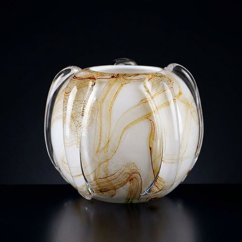 Empty amber marbled porcelain globe vase showing ribbed texture