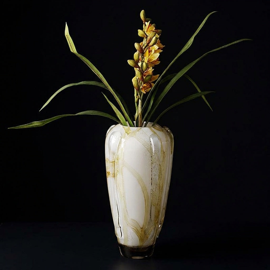 Tall amber marbled porcelain ribbed vase with orchid arrangement
