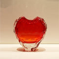 Single large faceted red crystal heart vase front view