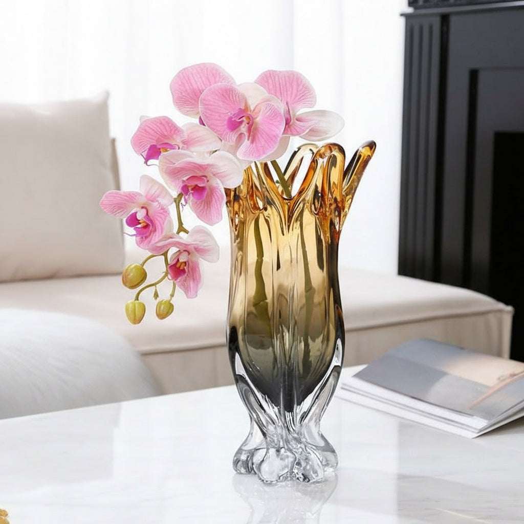 Amber and smoke gradient crystal vase with orchids on table