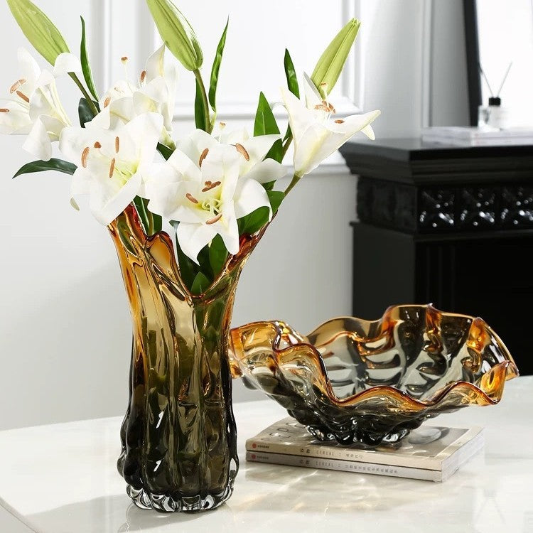 Tall amber glass vase with white lilies and matching bowl