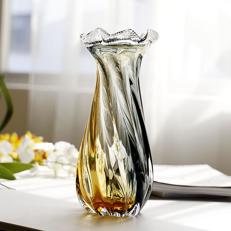 Medium twisted art glass vase on white table