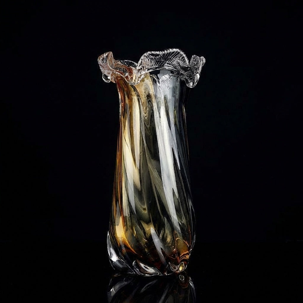 Large amber and smoke glass vase on book