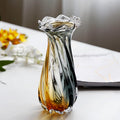 Medium art glass vase with ruffled rim in sunlight