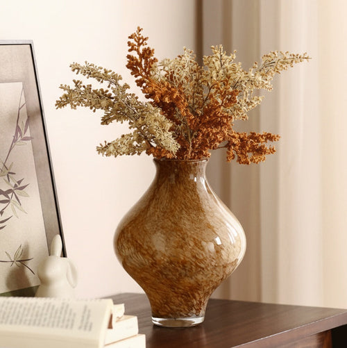 Full view of amber glass vase with mottled pattern