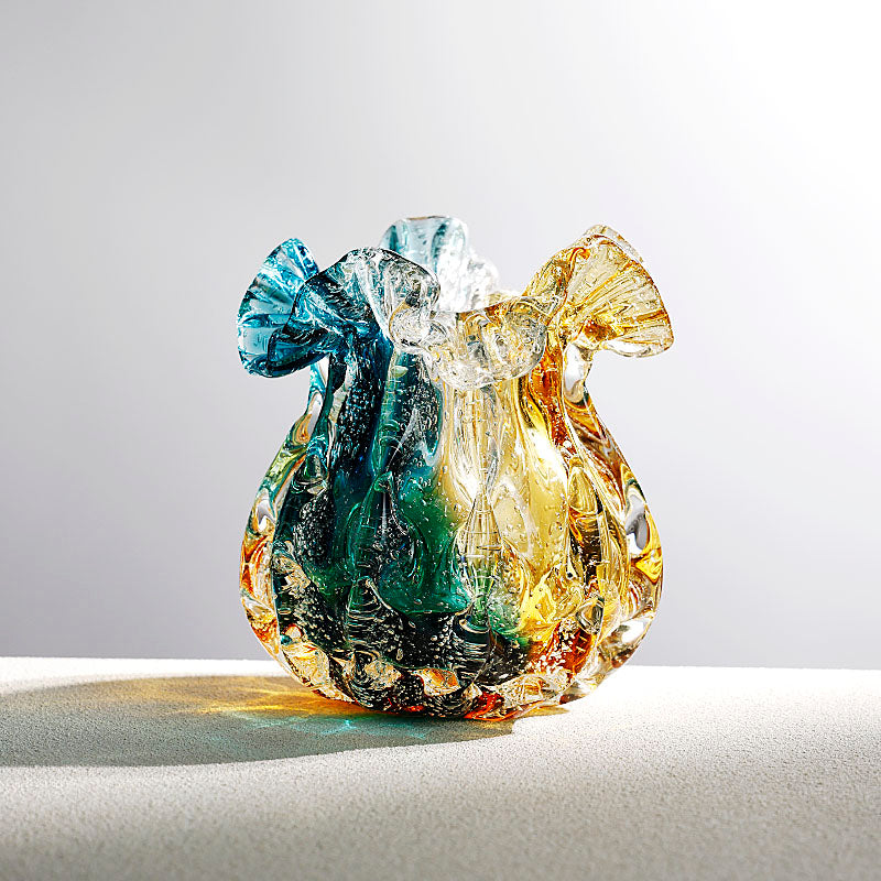 Small amber and teal art glass vase with ruffled rim