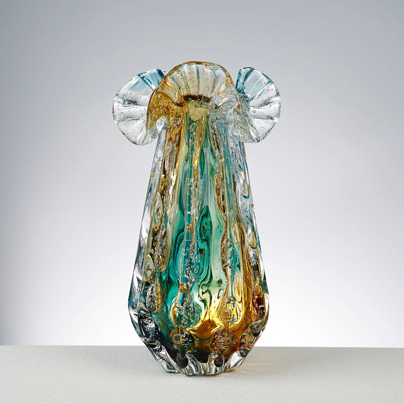 Front view of tall multicolored art glass vase