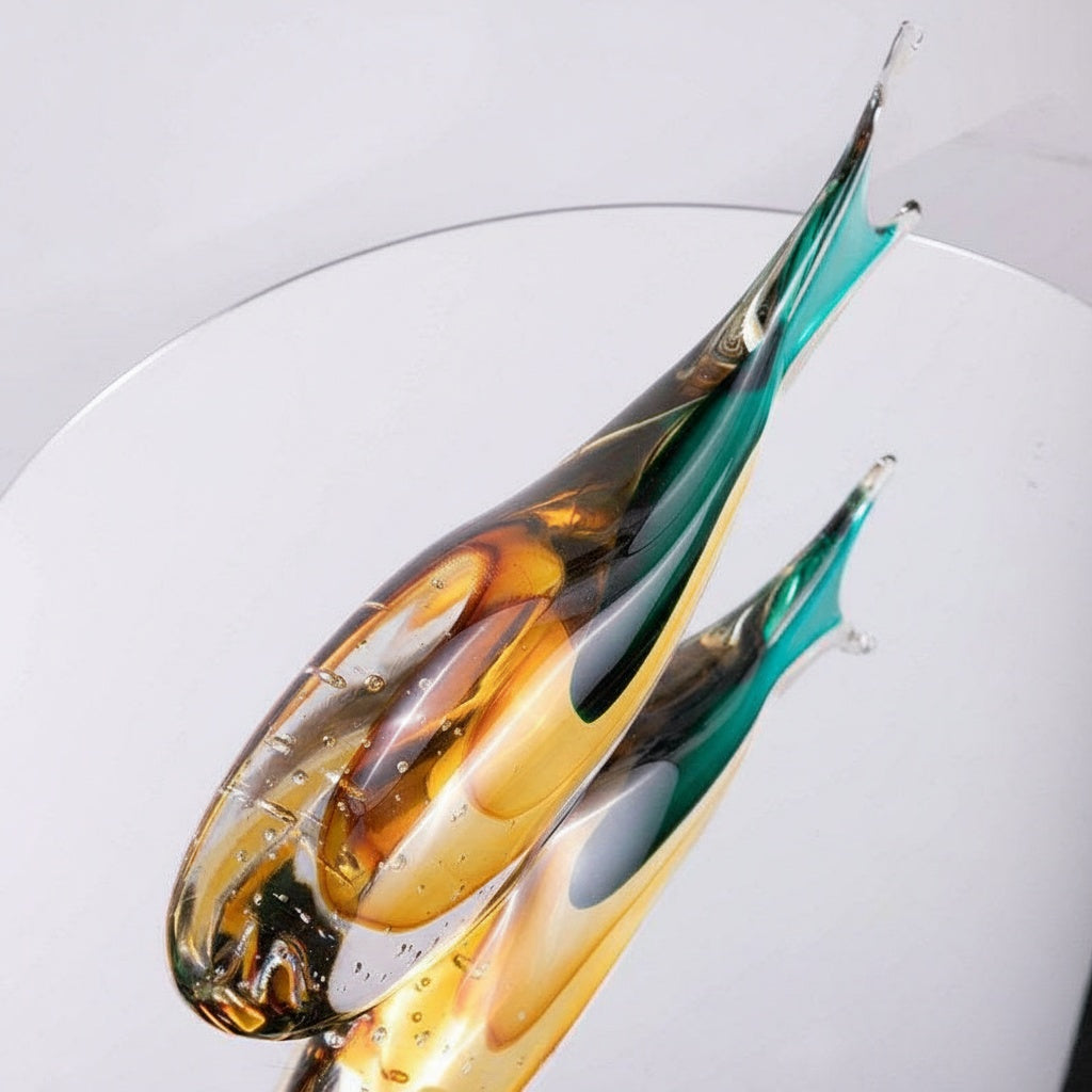 Front view of amber and teal art glass fish sculpture