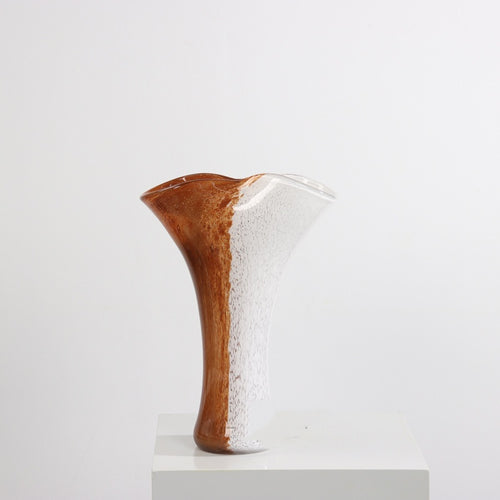 Tall amber and white speckled glass trumpet vase