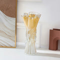 Close up of amber and white art glass vase with fluted rim